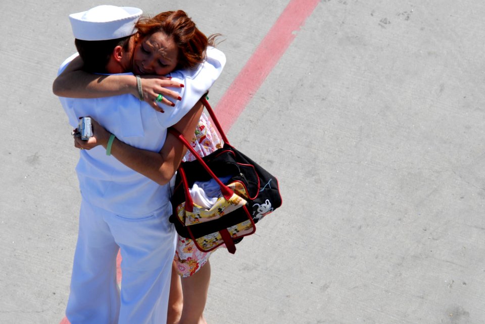 US Navy 070503-N-8273J-214 Seaman Brandon Tomason is welcomed home with a kiss by his wife, during a homeport arrival ceremony for the crew members of USS New Orleans (LPD 18) at Naval Base San Diego