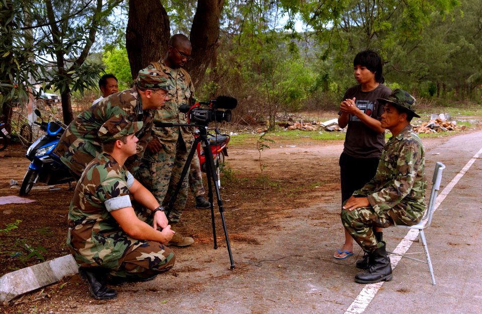 US Navy 070508-F-7806C-003 Cpl. Miller of Combat Camera based from Camp Smith, Master Sgt. Samson Ortiz, 4th Combat Camera, and Mass Communication Specialist 2nd Class Justin Nesbitt, Navy Public Affairs, interviews Chief Surap
