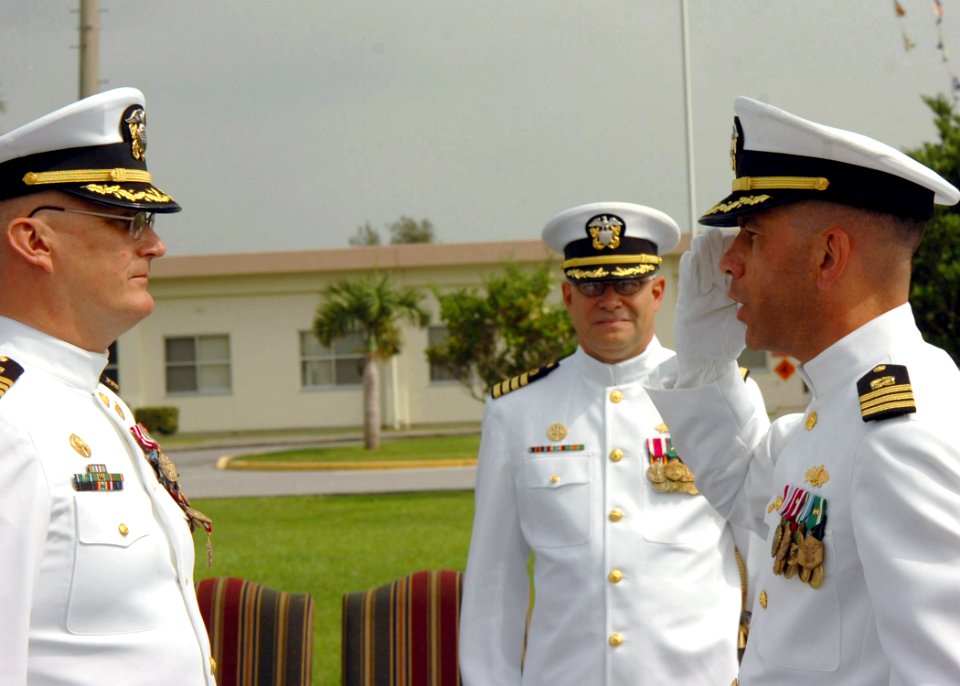 US Navy 070504-N-4198C-007 Cmdr. Tony M. Edmonds relieves Cmdr. Scott K. Higgins as commanding officer of Naval Mobile Construction Battalion (NMCB) 3, during the battalion's change of command ceremony at Camp Shields, Ok