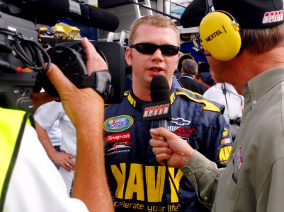 US Navy 070504-N-5345W-055 NASCAR Busch Series driver Shane Huffman, driver of the U.S. Navy ^88 Chevy Monte Carlo, answers questions from Speed Channel's Dick Berggren after qualifying a career-high 3rd for the Circuit City 25