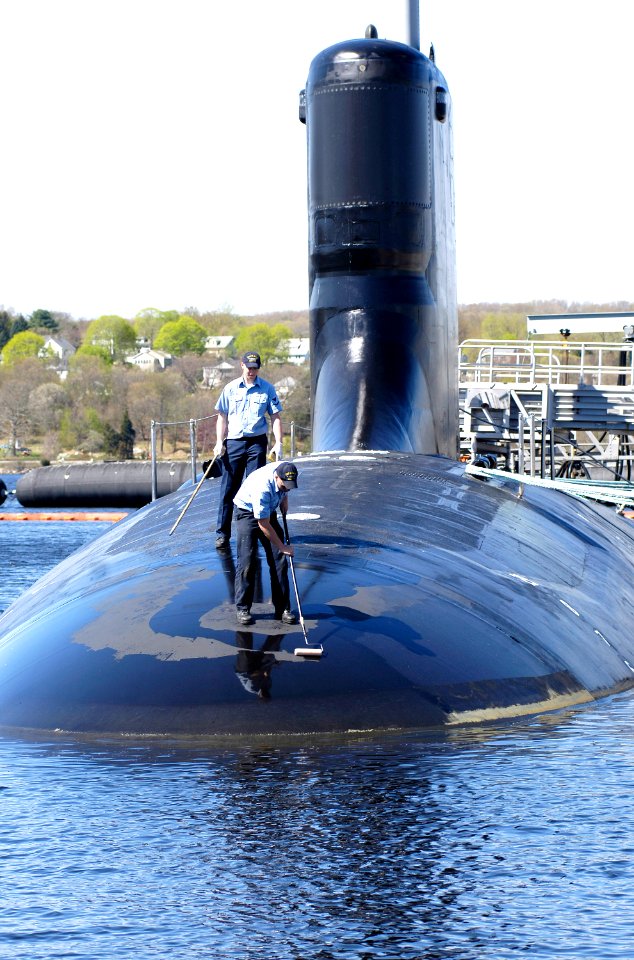 US Navy 070504-N-8467N-003 Sailors assigned to Virginia-class fast-attack submarine PCU Hawaii (SSN 776) paint the submarine while moored at Submarine Base New London