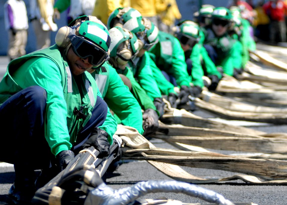 US Navy 070508-N-7981E-086 Members of air department work to raise an emergency barricade on the flight deck of Nimitz-class aircraft carrier USS Abraham Lincoln (CVN 72) during a general quarters (GQ) drill