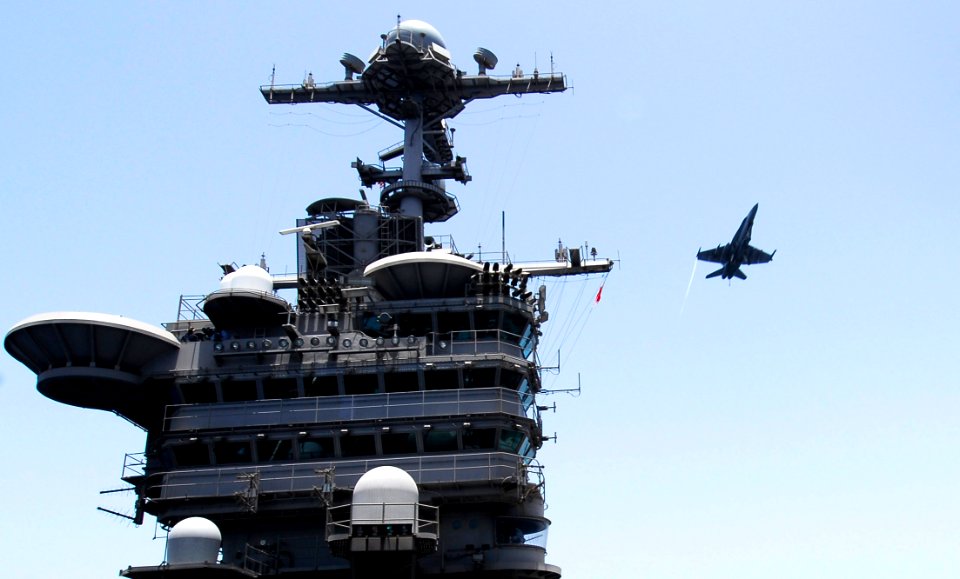 US Navy 070509-N-3729H-024 An F-A-18C Hornet, assigned to the Blue Diamonds of Strike Fighter Squadron (VFA) 146, flies over Nimitz-class aircraft carrier USS John C. Stennis (CVN 74)