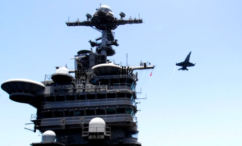 US Navy 070509-N-3729H-024 An F-A-18C Hornet, assigned to the Blue Diamonds of Strike Fighter Squadron (VFA) 146, flies over Nimitz-class aircraft carrier USS John C. Stennis (CVN 74)