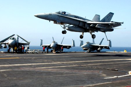 US Navy 070509-N-0890S-079 An F-A-18A-B Hornet, assigned to the Red Devils of Marine Fighter Attack Squadron (VMFA) 232, lands on the flight deck of the nuclear-powered aircraft carrier USS Nimitz (CVN 68)
