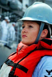 US Navy 070504-N-0879R-004 Quartermaster 2nd Class Lisa Kaeser, assigned to guided missile destroyer USS Hopper (DDG 70), stands by to release a mooring line