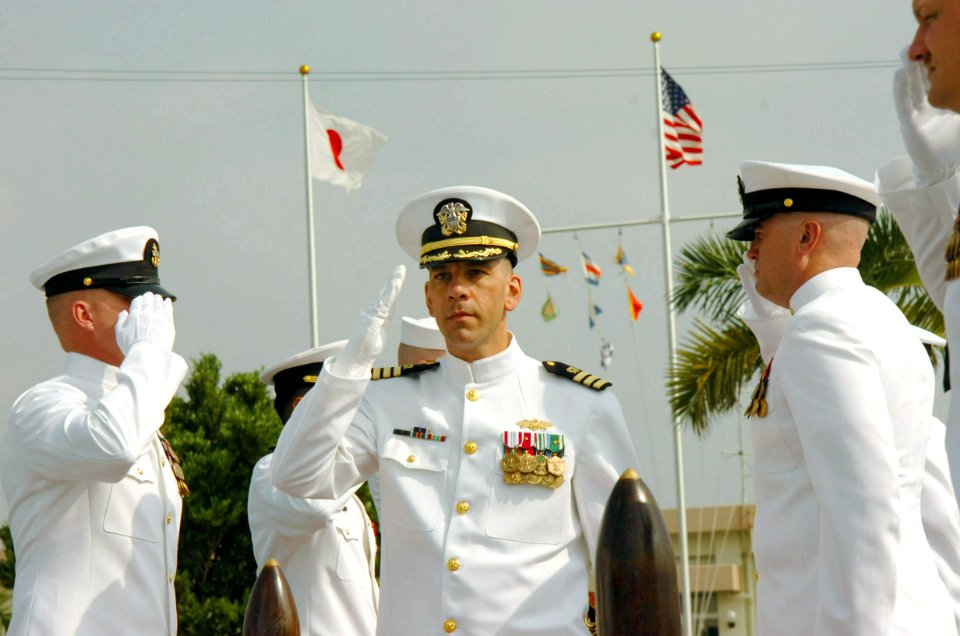 US Navy 070504-N-4198C-001 Cmdr. Tony M. Edmonds renders a salute as he arrives at the change of command ceremony for Naval Mobile Construction Battalion (NMCB) 3 at Camp Shields, Okinawa, Japan