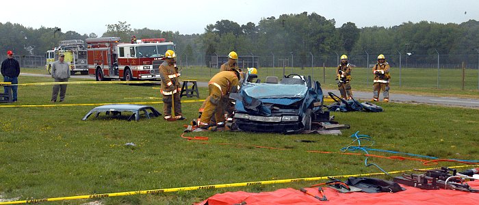 US Navy 070508-N-1082Z-003 Members of the Navy Mid-Atlantic Region Fire Department at Naval Air Station (NAS) Oceana simulate an emergency extraction rescue from a motor vehicle accident using the Jaws of Life