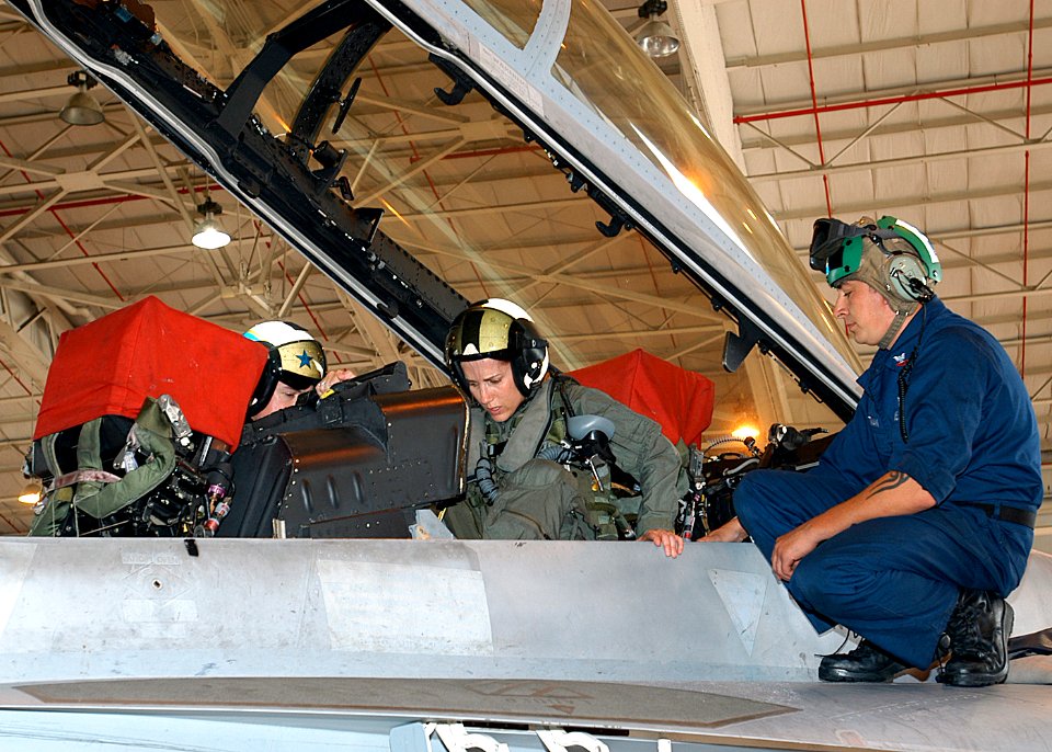 US Navy 070511-N-1082Z-005 Radio talk Show Host and Author, Laura Ingraham, receives a pre-flight brief from Lt. Ryan Fulwider and Aviation Structural Mechanic Equipmentman 2nd Class Jeremy Gottma