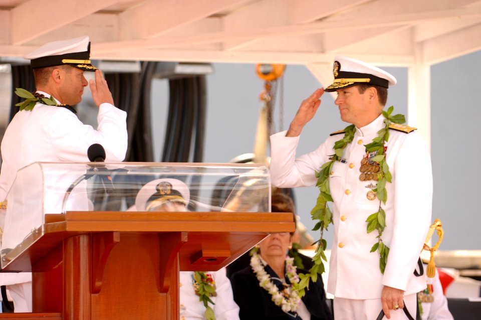 US Navy 070505-N-3642E-542 Capt. David Solms (left) salutes, Commander, Submarine Force, Vice Adm. John Donnelly, signifying he is reporting for duty and is in command of USS Hawaii (SSN 776)