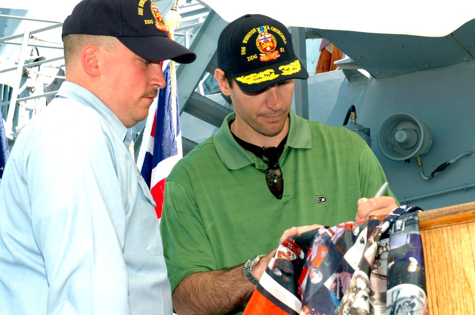 US Navy 070514-N-7975R-004 During a visit to USS Winston S. Churchill (DDG 81), Philadelphia Flyers Right Winger Mike Knuble took time to give an autograph to Fire Controlman 2nd Class Gerard Jossaume