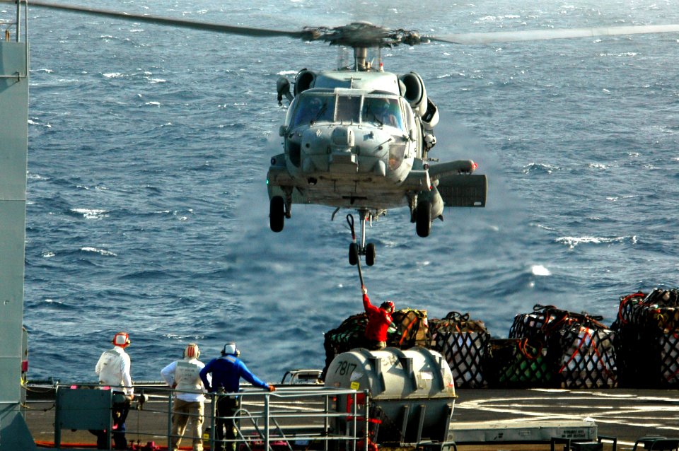 US Navy 070514-N-9760Z-015 An SH-60 Seahawk helicopter assigned to the Indians of Helicopter Antisubmarine Squadron (HS) 6 prepares to lift cargo during a vertical replenishment