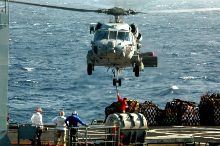 US Navy 070514-N-9760Z-015 An SH-60 Seahawk helicopter assigned to the Indians of Helicopter Antisubmarine Squadron (HS) 6 prepares to lift cargo during a vertical replenishment