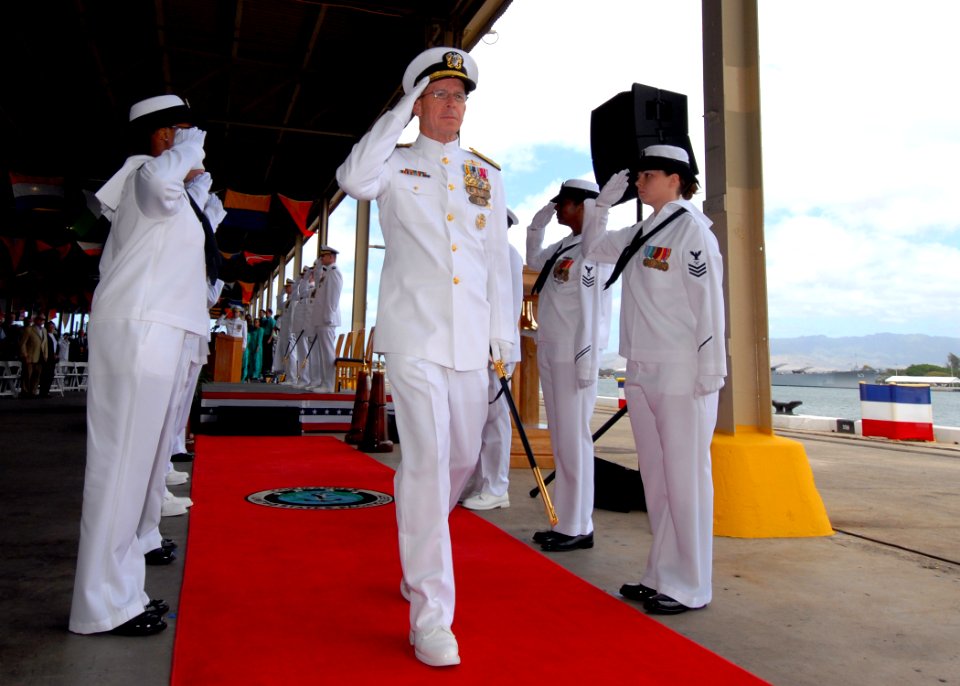 US Navy 070508-N-4965F-028 Chief of Naval Operations (CNO) Adm. Mike Mullen salutes as he is piped through the sideboys at the conclusion of a change of command ceremony