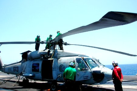 US Navy 070508-N-9760Z-001 Sailors assigned to the Indians of Helicopter Anti-Submarine Squadron (HS) 6, perform maintenance on the SH-60F Seahawk blades aboard nuclear-powered aircraft carrier USS Nimitz (CVN 68)