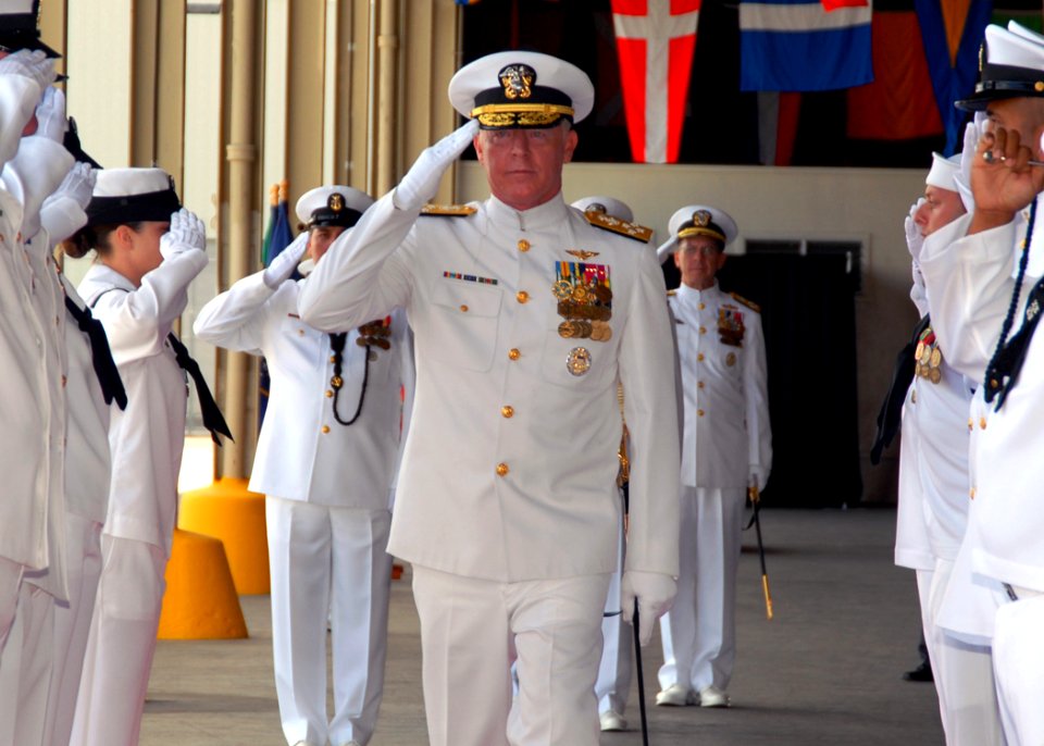US Navy 070508-N-4965F-002 Adm. Robert F. Willard, former Vice Chief of Naval Operations, salutes as he's piped through the sideboys during a change of command ceremony