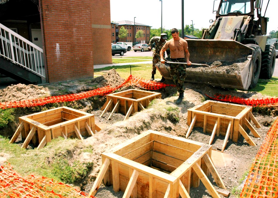 US Navy 070510-N-7427G-005 Builder 2nd Class Christopher Kershaw, assigned to the public works department, lays the foundation for a new hurricane proof pavilion outside of the barracks on Naval Air Station Joint Reserve Base,