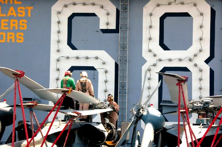 US Navy 070509-N-9760Z-017 Sailors assigned to the Indians of Helicopter Anti-Submarine Squadron (HS) 6, perform maintenance on SH-60F Seahawk blades aboard nuclear-powered aircraft carrier USS Nimitz (CVN 68)