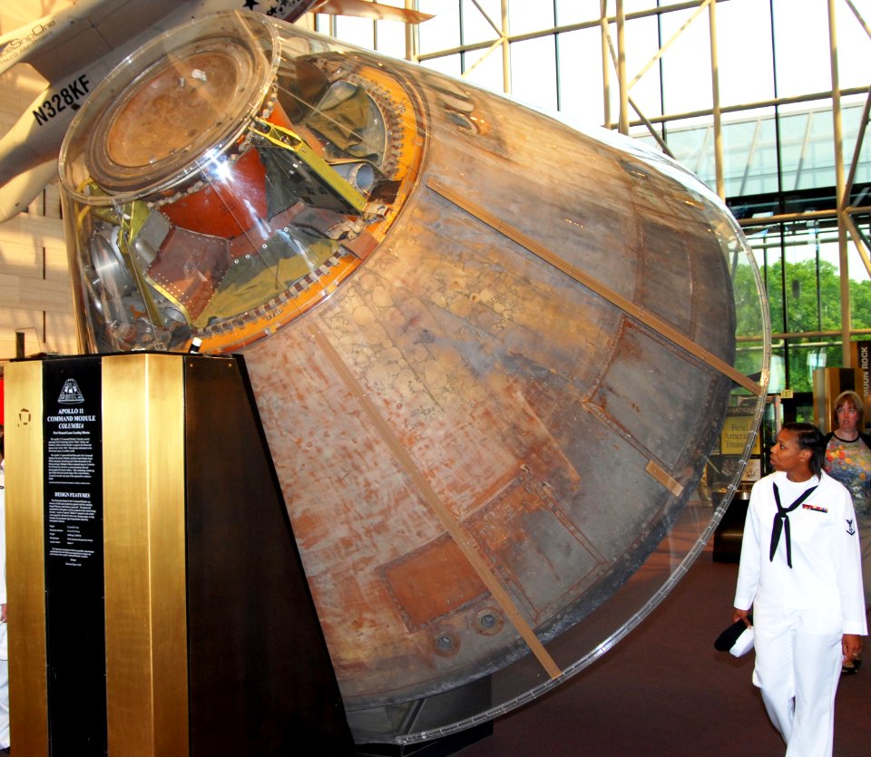 US Navy 070516-N-6724S-049 Machinist's Mate 3rd Class Davida Edwards examines the Apollo 11 Command Module in the lobby of the National Air and Space Museum