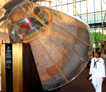 US Navy 070516-N-6724S-049 Machinist's Mate 3rd Class Davida Edwards examines the Apollo 11 Command Module in the lobby of the National Air and Space Museum