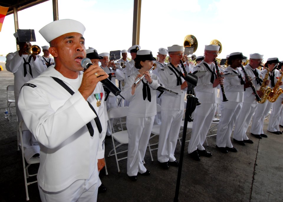 US Navy 070508-N-4965F-010 Musician 3rd Class Hilario Mireles Jr., assigned to the U.S. Pacific Fleet Band, sings the National Anthem during a change of command ceremony