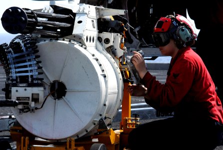 US Navy 070508-N-5484G-007 Aviation Ordnanceman 2nd Class Tina Greer maintains an M61A1 20mm rotary canon on the flight deck of nuclear-powered aircraft carrier USS Nimitz (CVN 68)
