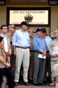 US Navy 070512-N-3642E-047 Sen. Mel Martinez and the Secretary of the Navy (SECNAV), the Honorable Dr. Donald C. Winter, listen to a brief about the safe and humane care of detained enemy combatants housed in Camp Delta