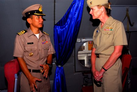 US Navy 070509-N-4124C-015 A Royal Thai Navy officer speaks with Expeditionary Strike Group (ESG) 7 Commander, Rear Adm. Carol M. Pottenger, about the capabilities of the Thai P-3 aircraft photo