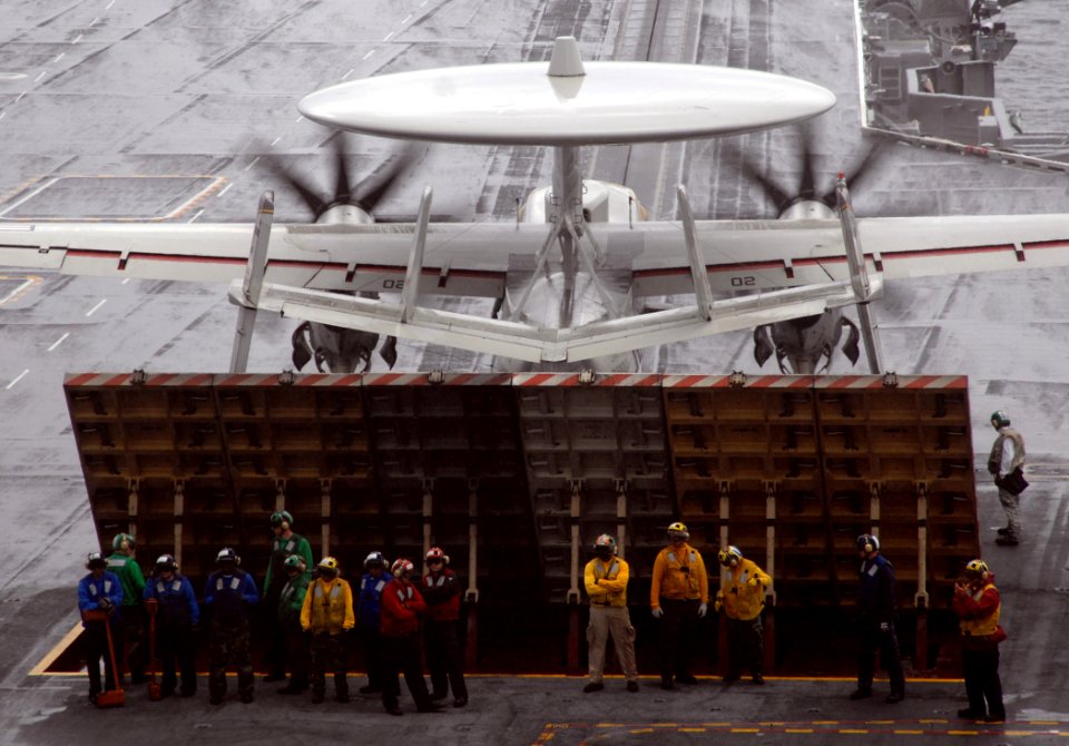US Navy 070517-N-8923M-032 Sailors from air department take cover from the rain during flight operations aboard Nimitz-class aircraft carrier USS Harry S. Truman (CVN 75)