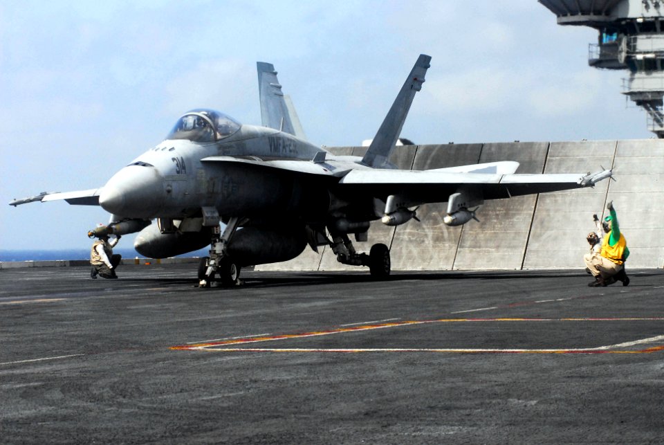 US Navy 070515-N-6326B-022 Sailors prepare to launch an F-A-18A Hornet assigned to the Red Devils of Marine Fighter Attack Squadron (VMFA) 232 off the flight deck of the nuclear-powered aircraft carrier USS Nimitz (CVN 68)
