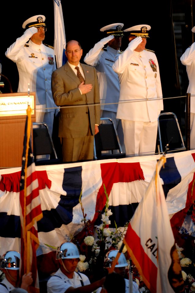 US Navy 070515-N-3642E-188 The Secretary of the Navy (SECNAV), the Honorable Dr. Donald C. Winter, covers his heart during the national anthem at the christening ceremony of USNS Richard E. Byrd (T-AKE 4)