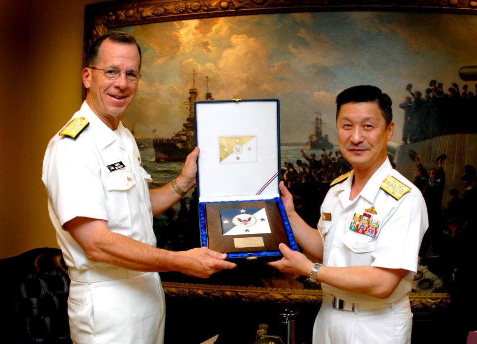 US Navy 070518-N-0696M-116 Chief of Naval Operations (CNO) Adm. Mike Mullen presents Adm. Eiji Yoshikawa, Chief of Staff, Japan Maritime Self-Defense Force with a plaque during an office call at the Pentagon