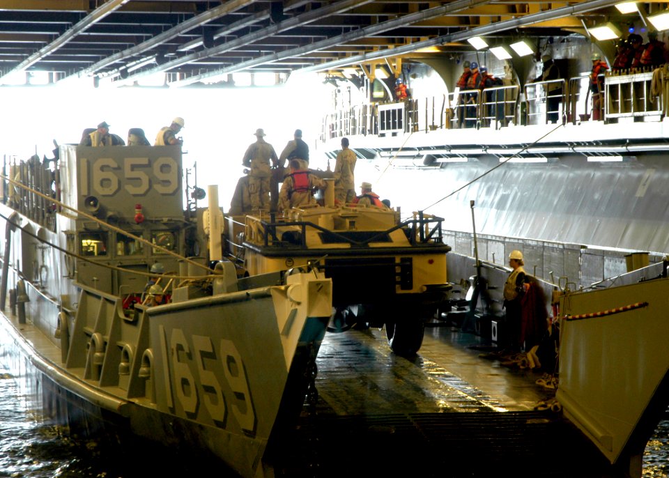 US Navy 070515-N-8087D-018 Sailors assigned to the amphibious assault ship USS Wasp (LHD 1) load a service vehicle aboard Landing Craft Unit (LCU). LCUs are primarily used to transport personnel and vehicles