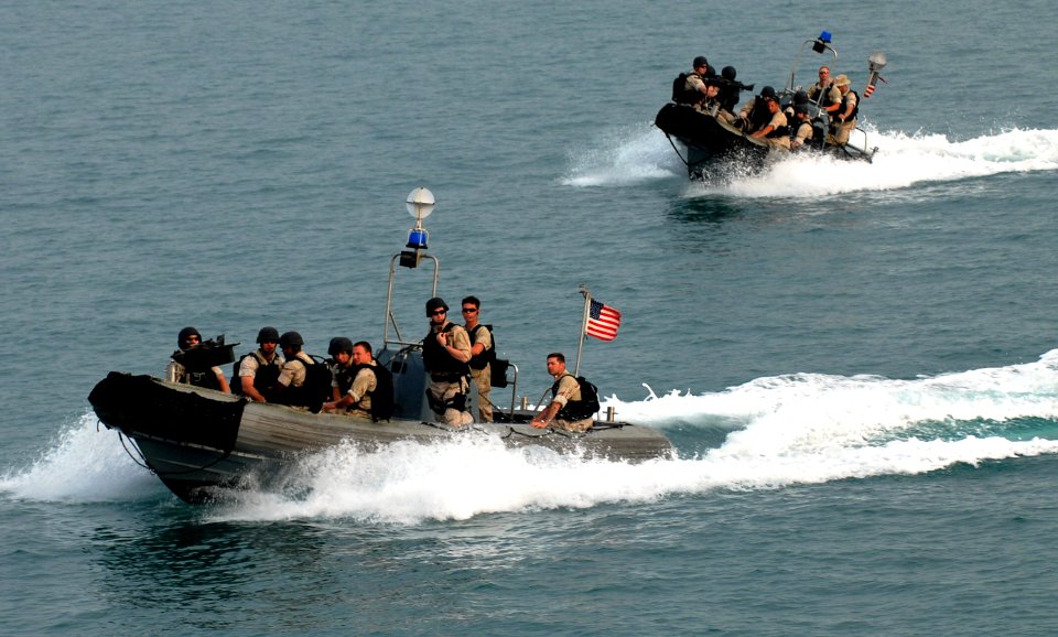US Navy 070515-N-0684R-020 Sailors approach guided-missile destroyer USS Preble (DDG 88) in a pair of rigid hull inflatable boats after a day of performing interaction patrols (IPATS) in the Persian Gulf