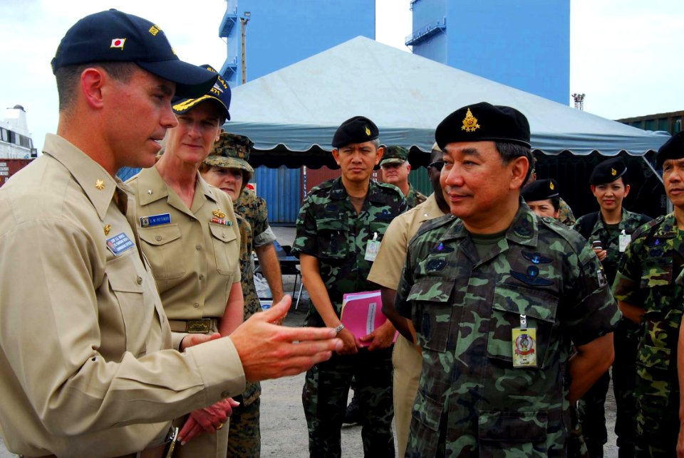 US Navy 070516-N-4124C-053 Lt. Cmdr. Steven H. DeMoss, commanding officer, USS Guardian (MCM 5), explains the capabilities of the mine warfare ship to Royal Thai Army Gen. Kemarat Kanchanawat, Royal Thai Armed Forces Deputy Chi