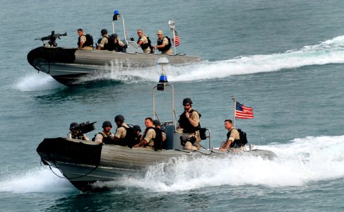 US Navy 070515-N-0684R-019 Sailors approach guided-missile destroyer USS Preble (DDG 88) in a pair of rigid hull inflatable boats photo