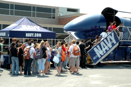 US Navy 070516-N-7975R-003 Students of Caesar Rodney High School stand in line to get their chance to ride the Navy's F-A-18 Super Hornet Fighter Jet Flight Simulator