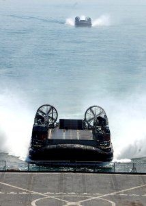 US Navy 070520-N-6710M-001 Two landing craft air cushions prepare to enter the well deck of dock landing ship USS Tortuga (LSD 46)