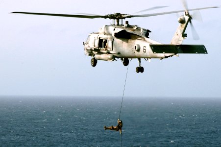 US Navy 070516-N-0890S-095 Explosive Ordinance Disposal Mobile Unit (EODMU) Detachment 3 practices fast-rope exercises from an SH-60F Seahawk assigned to the Indians of Helicopter Anti-Submarine Squadron (HS) 6 aboard nuclear-p