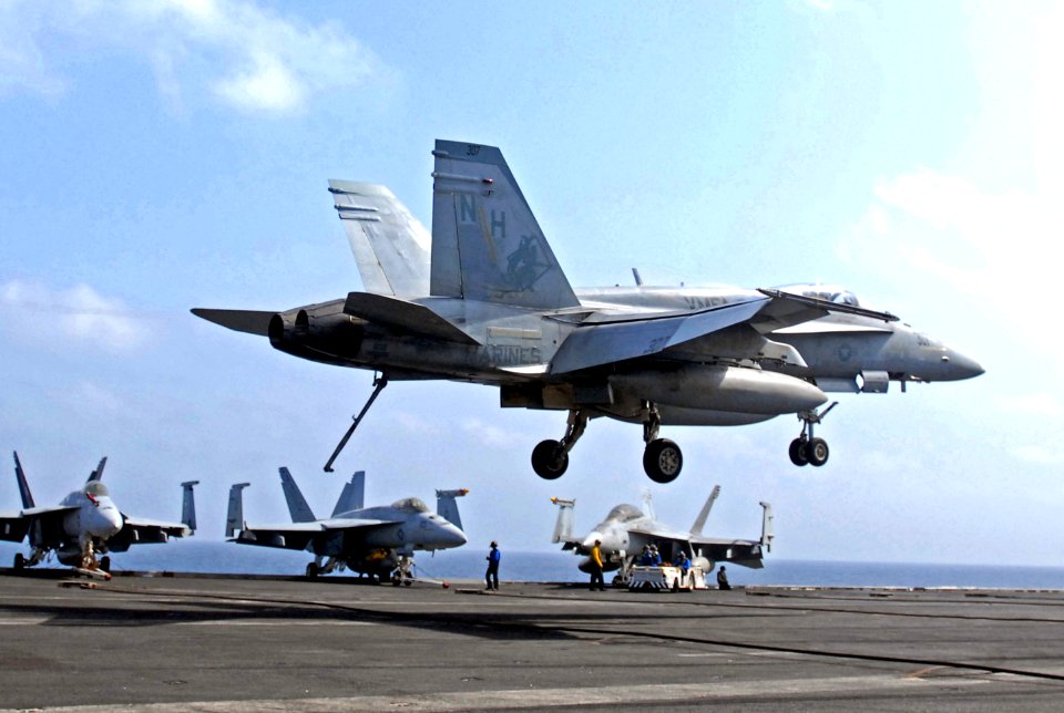 US Navy 070520-N-5484G-035 An F-A-18A Hornet, assigned to the Red Devils of Marine Strike Fighter Squadron (VMFA) 232, lands on the flight deck of the nuclear-powered aircraft carrier USS Nimitz (CVN 68)