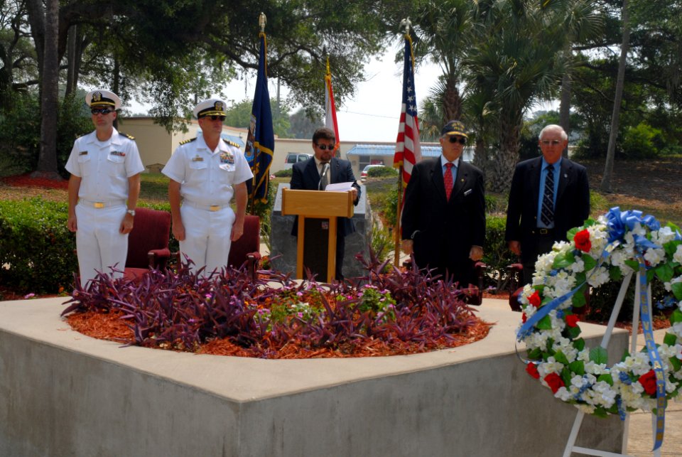 US Navy 070517-N-8102J-077 Former USS Stark (FFG 31) crewmember Tim Martineau reads the names of the fallen Sailors during the tolling of the bell at the USS Stark 20-year anniversary memorial ceremony