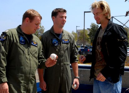 US Navy 070514-N-9604C-037 Cincinnati Reds pitcher Bronson Arroyo signs a baseball for a fan during his visit to Helicopter Maritime Strike Squadron (HSM) 41
