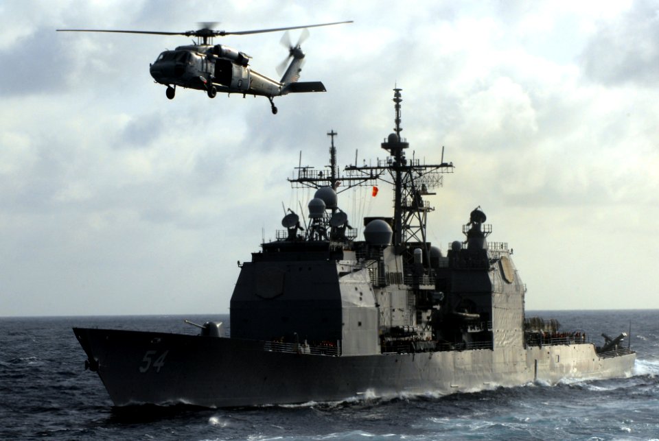 US Navy 070515-N-2659P-026 USS Antietam (CG 54) approaches USNS Bridge (T-AOE 10) to begin a replenishment at sea along with Nimitz-class aircraft carrier USS John C. Stennis (CVN 74)