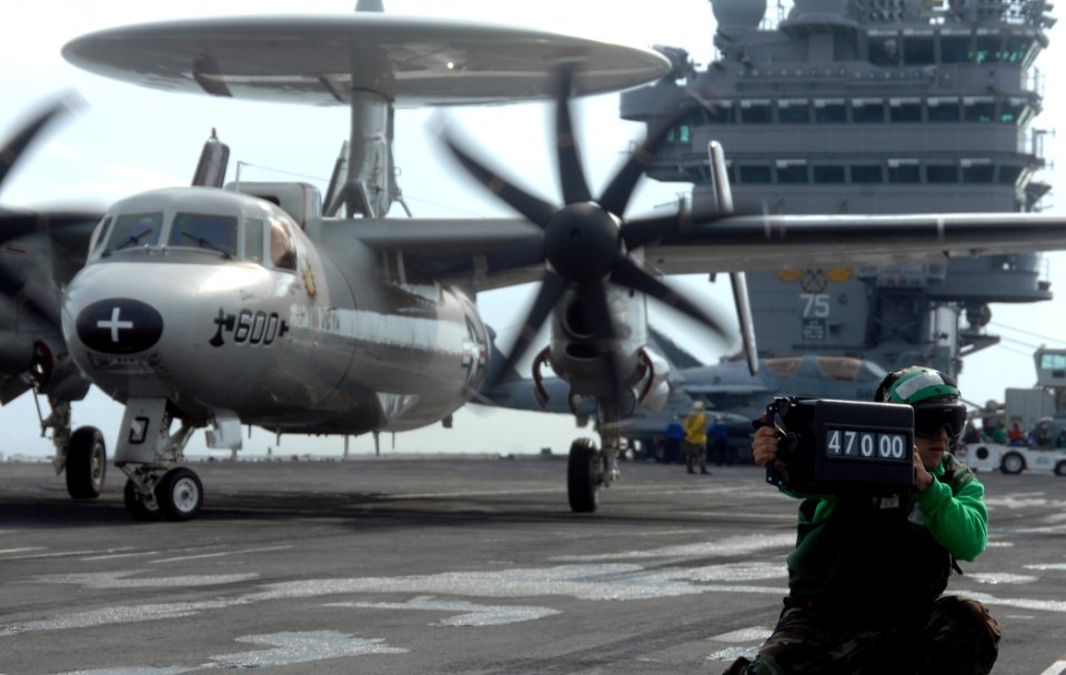US Navy 070517-N-8923M-175 A weight board operator from air department shows an aircraft handler the weight of an E2-C Hawkeye during flight operations on board Nimitz-class aircraft carrier USS Harry S. Truman (CVN 75)