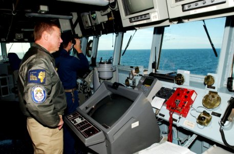 US Navy 070515-N-5459S-004 Commander, Standing NATO Maritime Group One (SNMG1), Rear Adm. Michael K. Mahon observes the horizon of the Baltic Sea from the bridge of guided missile destroyer USS Mahan (DDG 72)