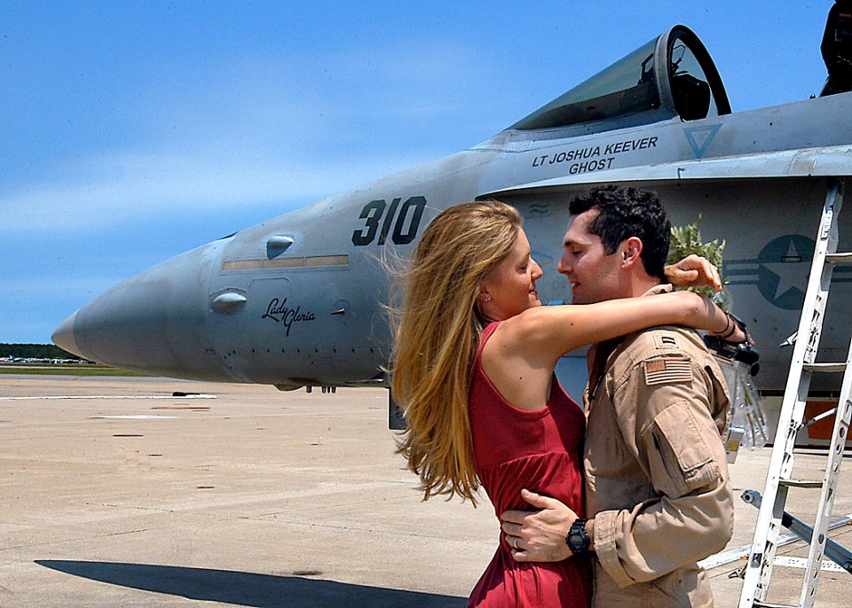 US Navy 070522-N-1082Z-006 Lt. Joshua Keever assigned to the Rampagers of Strike Fighter Squadron (VFA) 83 greets his wife after arriving home