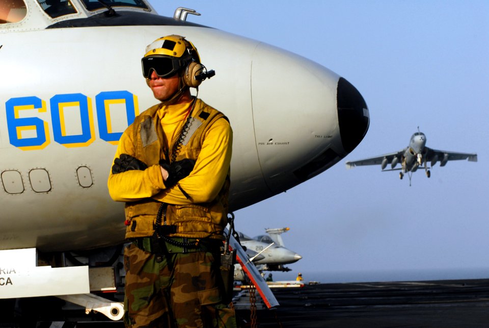 US Navy 070518-N-2659P-280 Aviation Boatswain's Mate (Handling) 2nd Class Curtis Page awaits the next aircraft movement