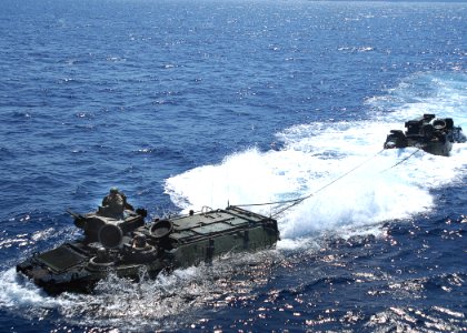 US Navy 070521-N-5067K-227 Echo company Battalion Landing Team (BLT) 2-1 approaches Austin-class amphibious transport dock USS Juneau (LPD 10)