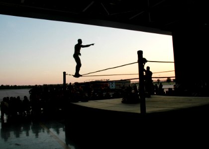 US Navy 070519-N-7427G-001 Professional wrestler Kevin Northcutt stands on the top rope during a match held on Naval Air Station, Joint Reserve Base, New Orleans