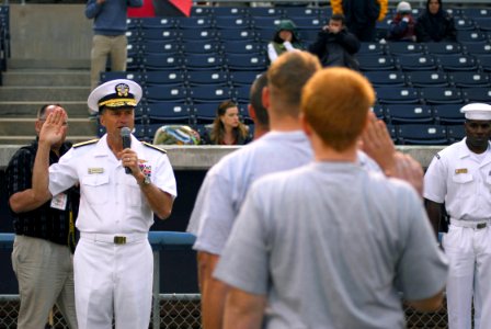 US Navy 070518-N-1688B-157 Rear Adm. James Winnefeld Jr., director of Joint Innovation and Experimentation Directorate, administers the oath of enlistment to future Sailors during Military Appreciation Night at Harbor Park photo